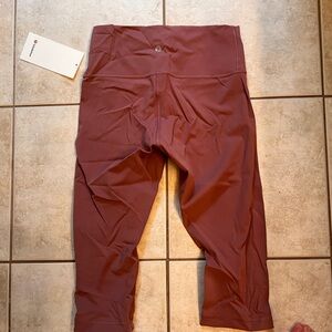 Lululemon wunder under HR 1/2 tight size 8 dark pink, tag on never worn